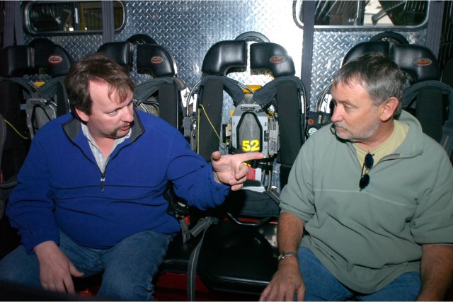 Academy Award winning Director Bill Couturie' (right) chats with Hudson FD Captain Craig Haigh during filming of &quot;Into the Fire&quot;. Hudson FD was one of a the fire departments featured in the film which aired on the History Channel in October 2006. Chip Moon photo